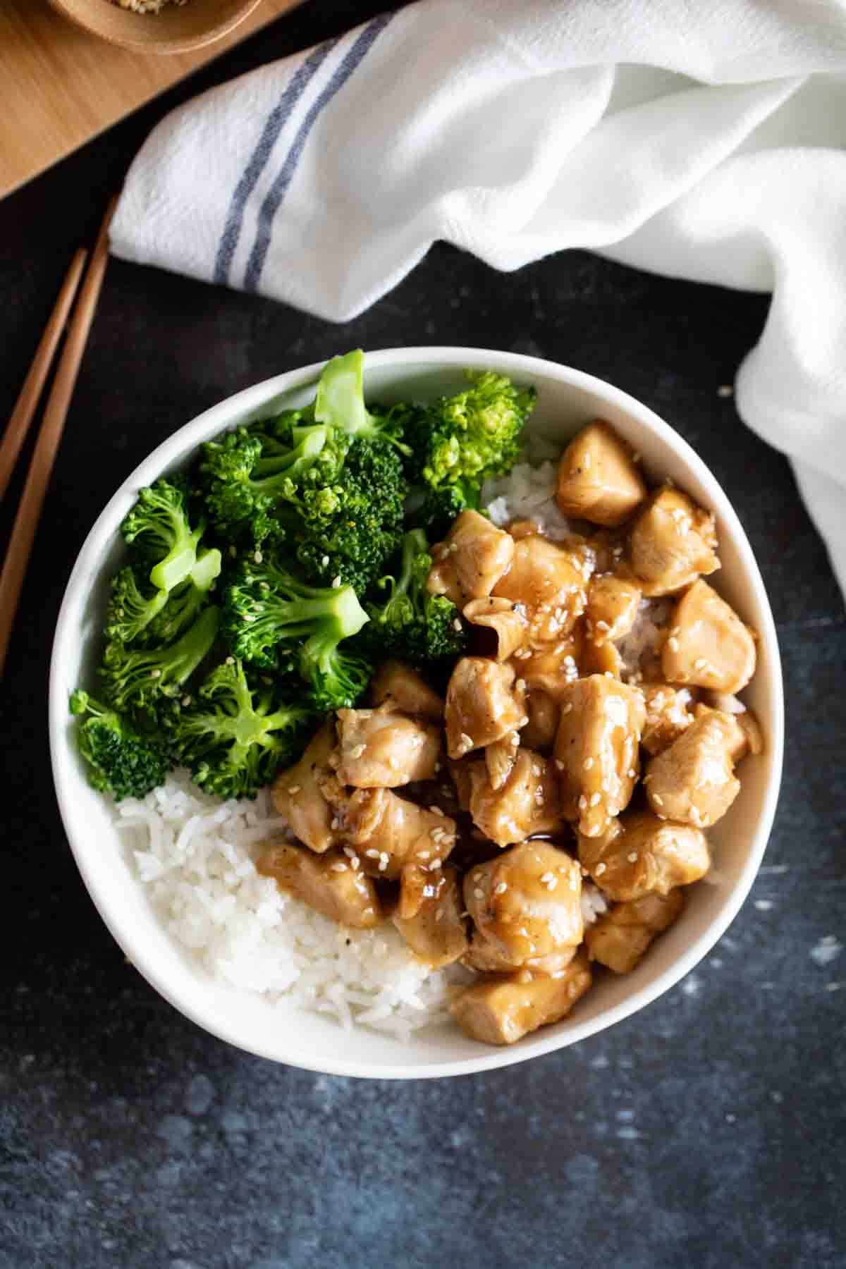 rice, steamed broccoli, and teriyaki chicken in a bowl