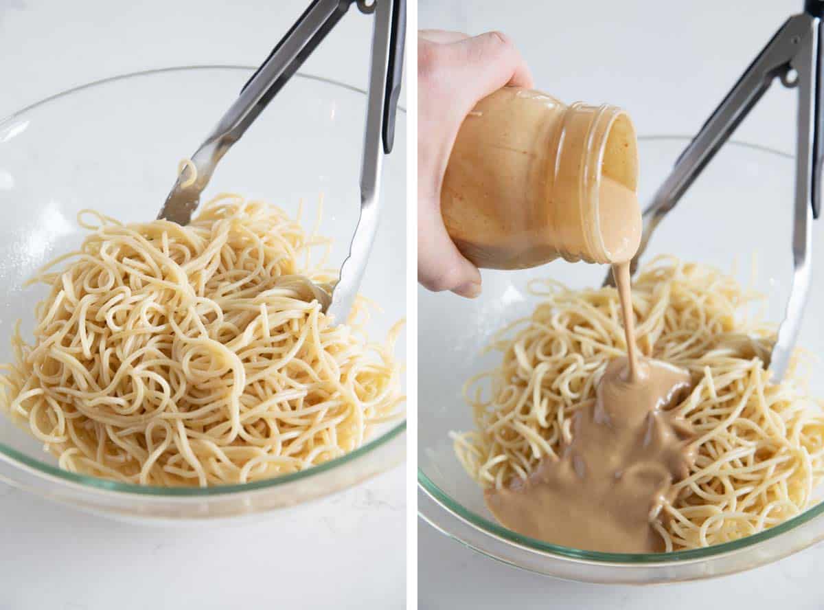 pouring peanut sauce over spaghetti noodles