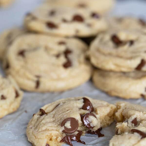 toll house chocolate chip cookie broken in half with melted chocolate chips