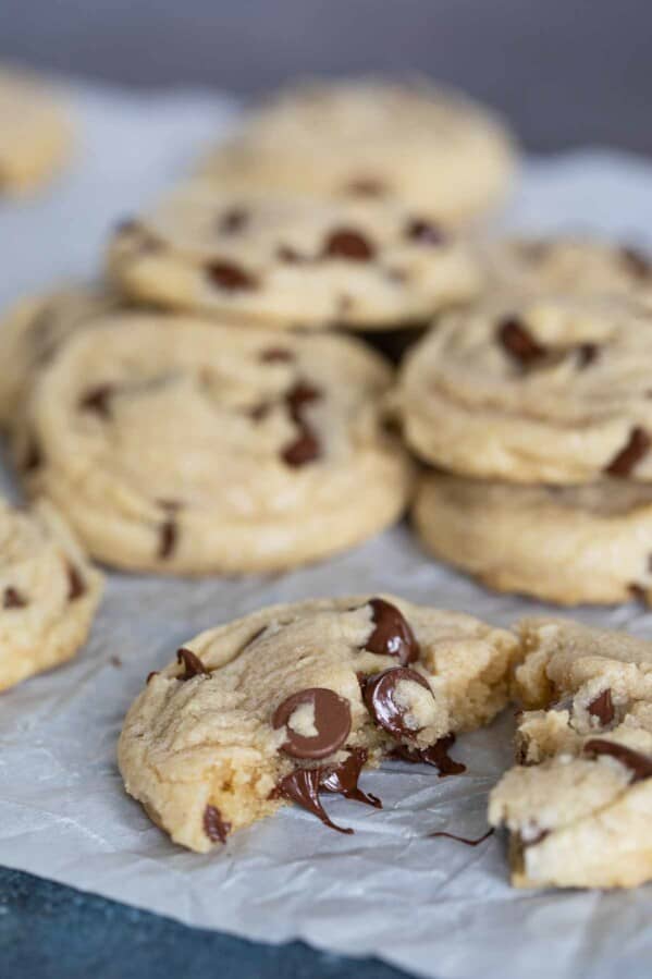 toll house chocolate chip cookie broken in half with melted chocolate chips