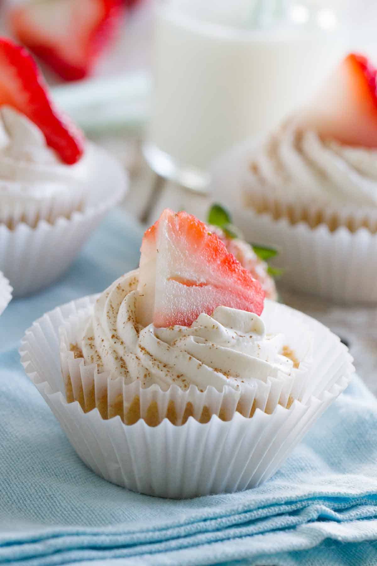 Tres Leches Cupcakes topped with a strawberry