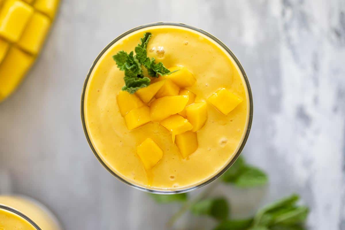 fresh fruit batido topped with fresh mango and mint.