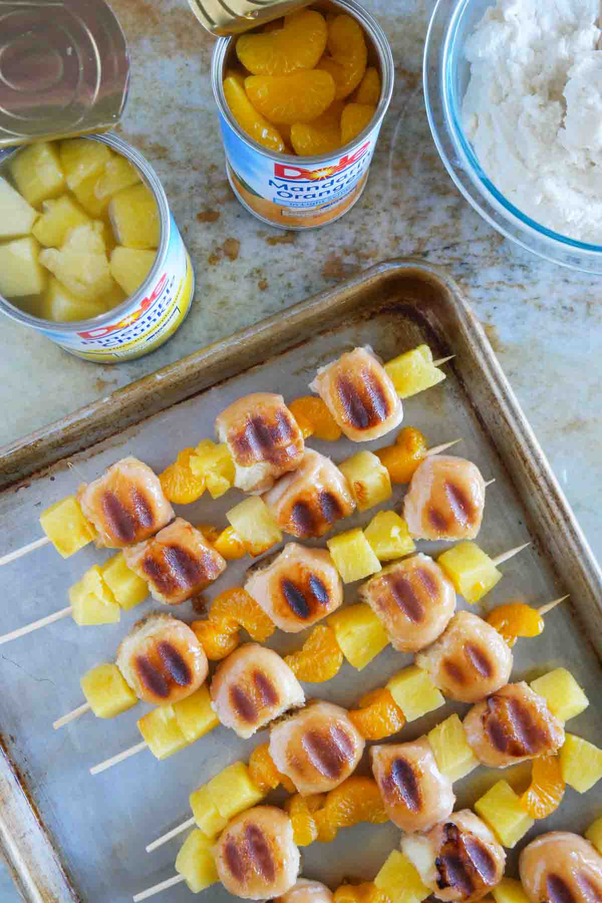 Donut Kabobs with pineapple and oranges that have been grilled