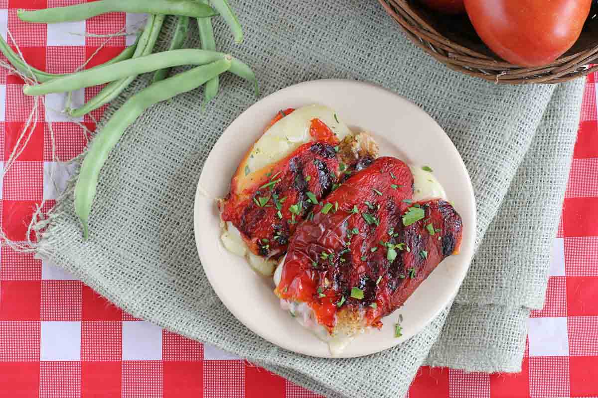 Grilled Roasted Red Peppers Stuffed with Cheese with parsley on top