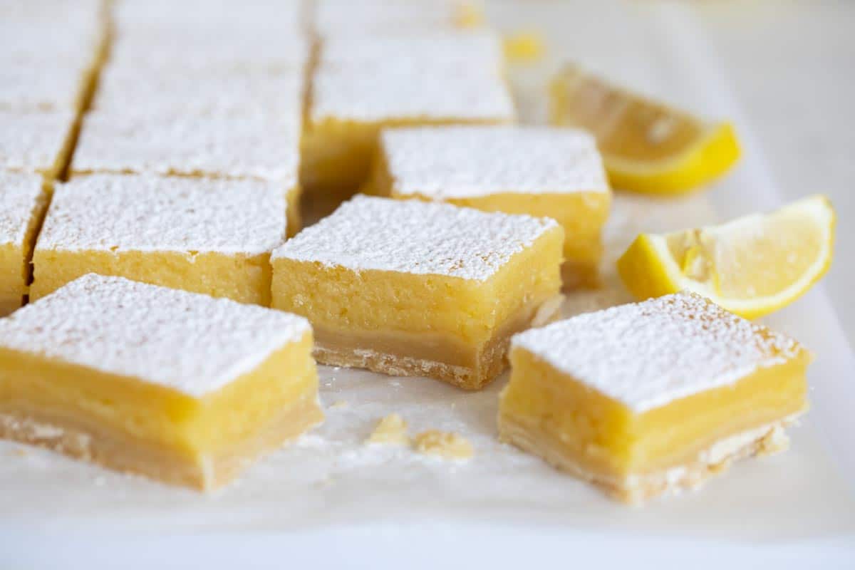 sliced lemon bars with slices of lemon
