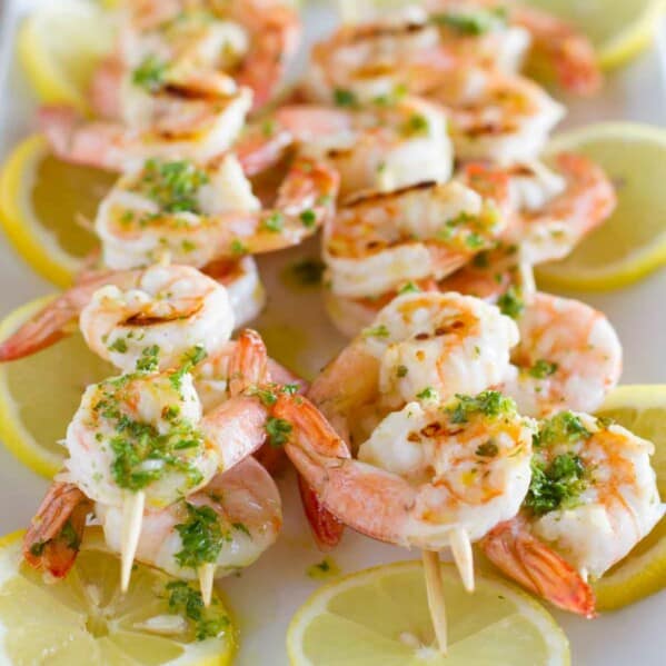 Grilled Lemon Shrimp Kabobs served over lemon slices.