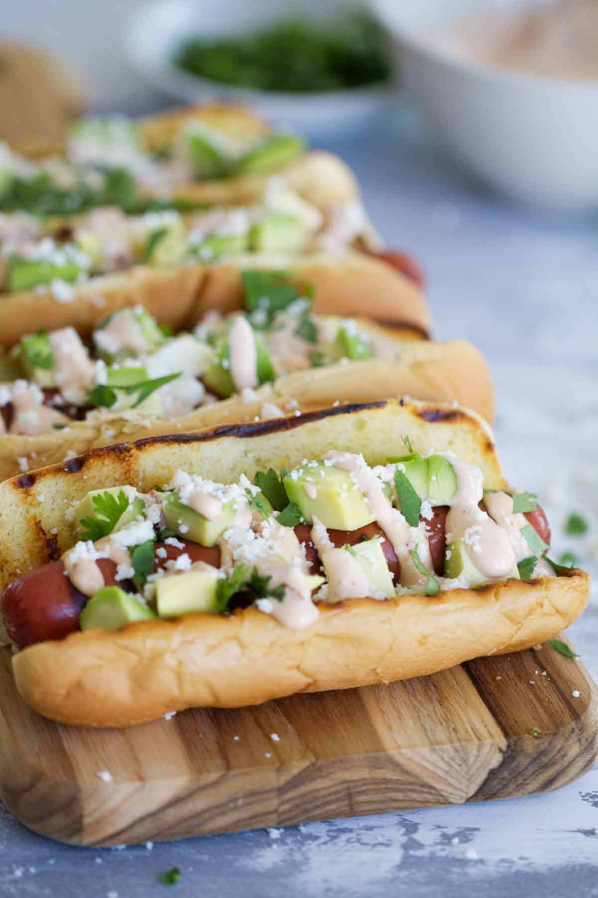 Mexican Hot Dogs on a cutting board