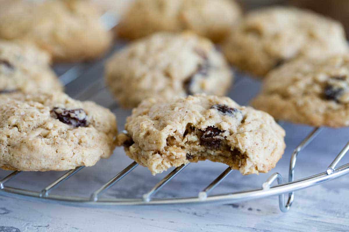 Oatmeal cookie with raisins with a bite taken from it