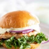 Salmon Burger topped with Ginger Wasabi Mayo with lettuce and onion
