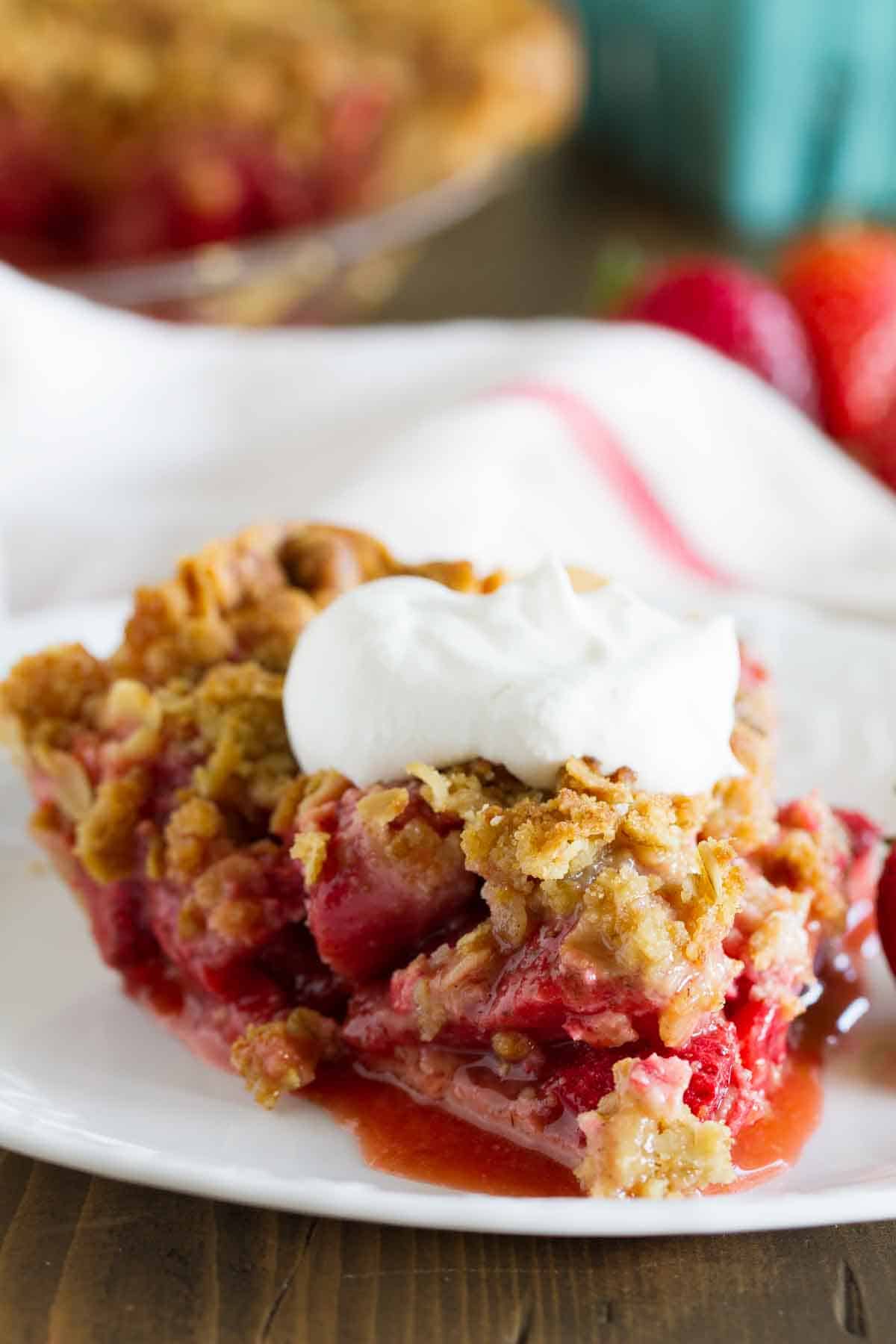 slice of Strawberry Crumble Pie topped with whipped cream