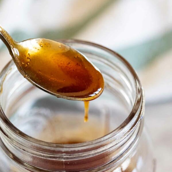 spoon full of sweet and sour sauce out of a jar