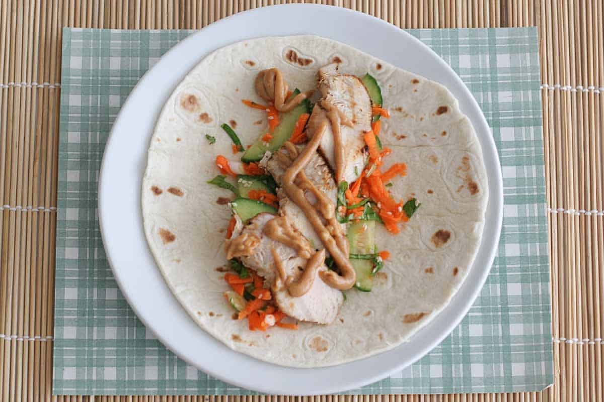 open thai chicken wrap with spicy peanut sauce