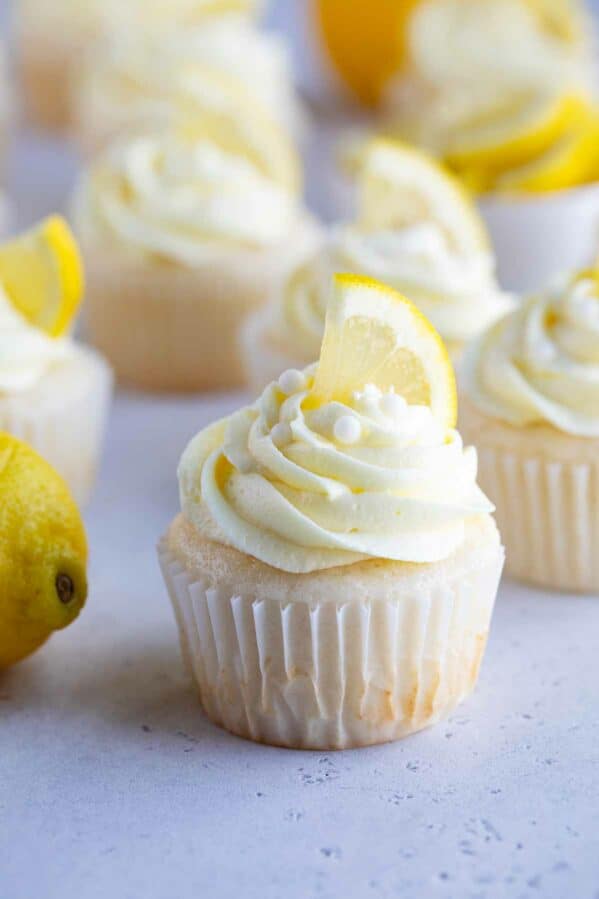 Lemon Buttercream Frosting on top of cupcake with a lemon slice