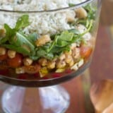 Layered bean salad with hearts of palm and blue cheese.