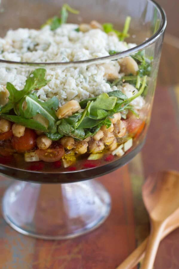 Layered bean salad with hearts of palm and blue cheese.
