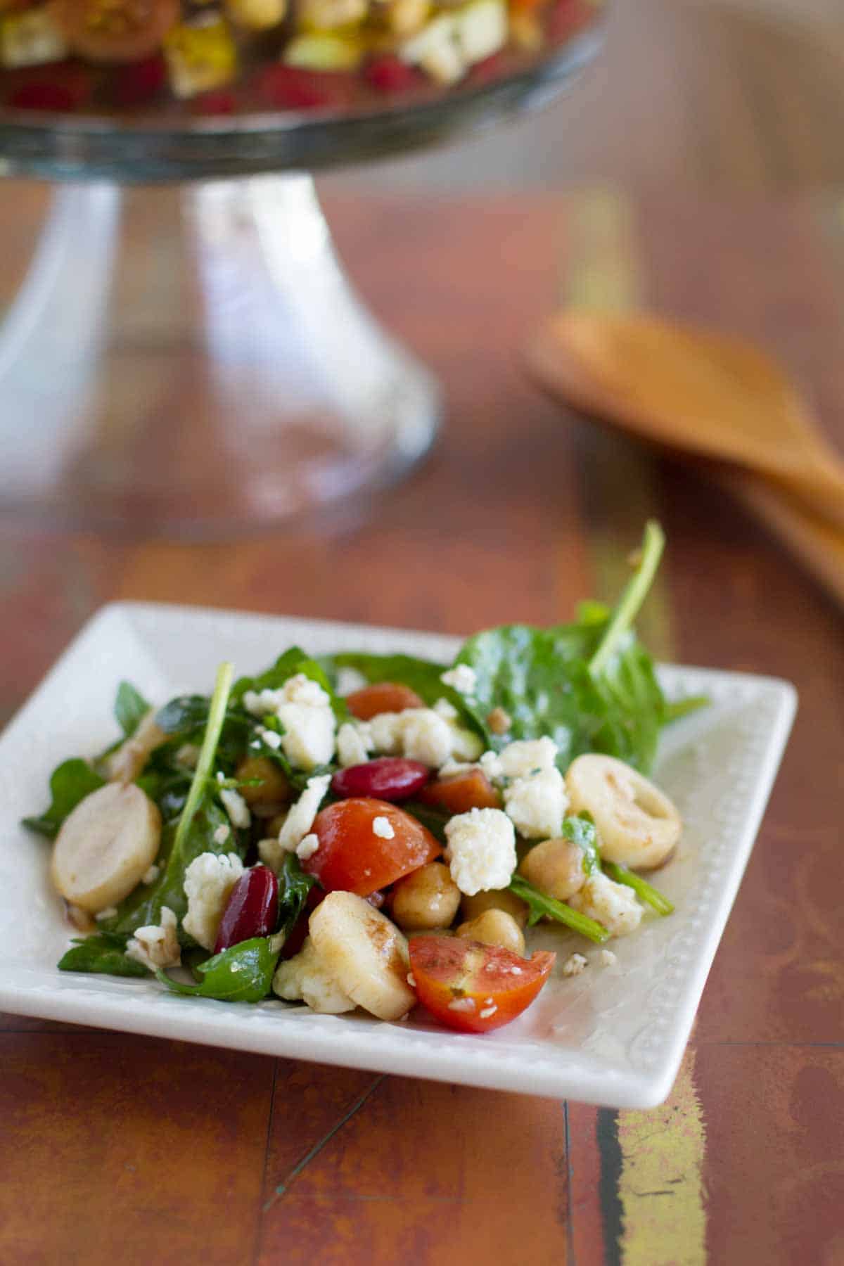 Serving of Bean Salad with Hearts of Palm and Blue Cheese on a plate.