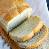 Potato bread on a cutting board with a few slices cut