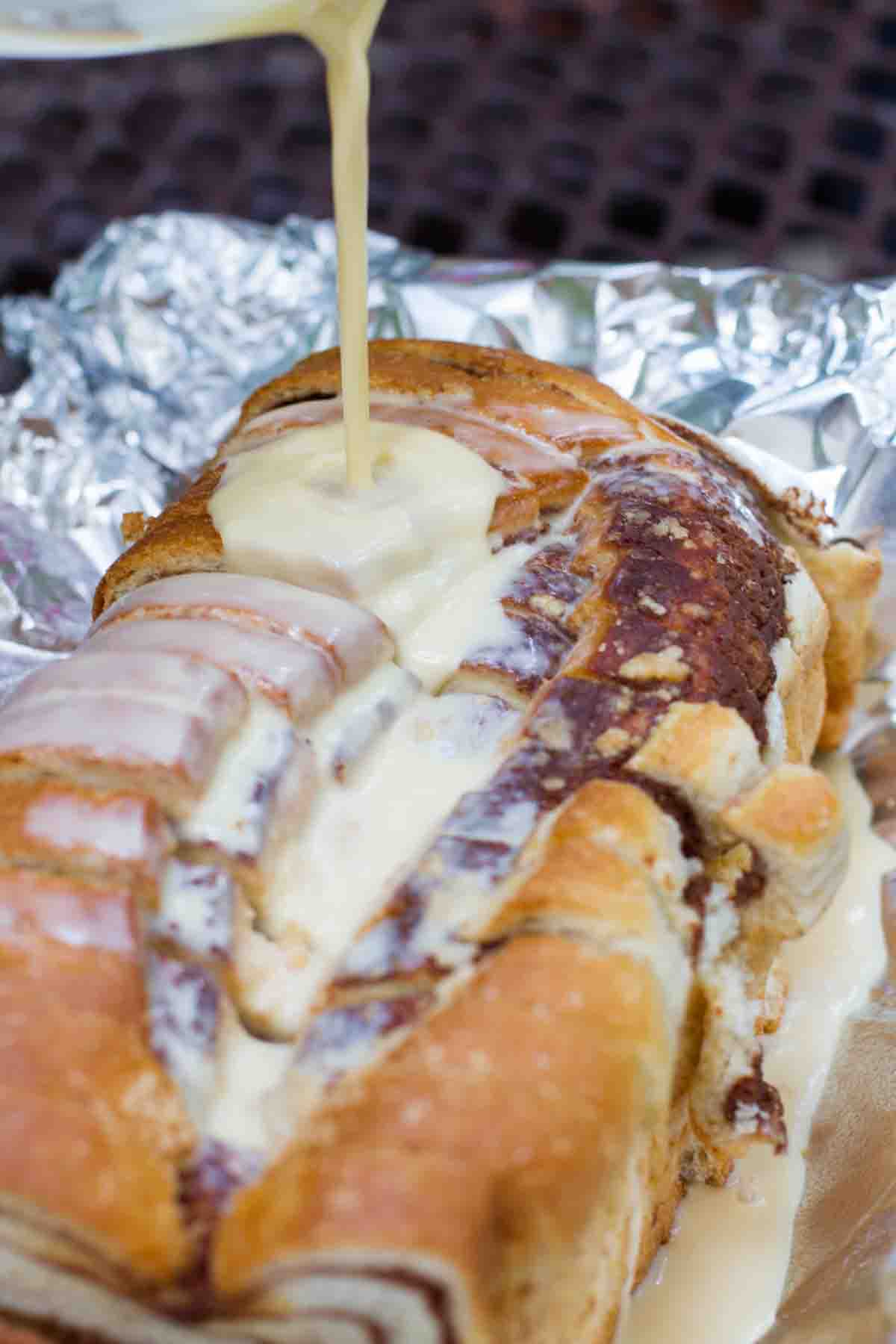 pouring custard mixture over campfire cinnamon bread