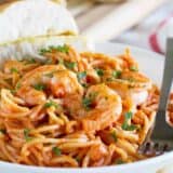 Serving of Creamy Shrimp and Tomato Pasta with garlic bread