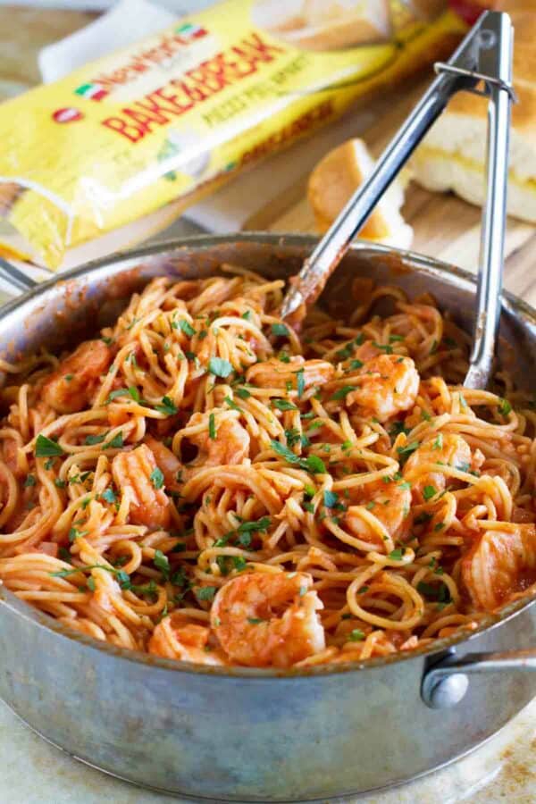 Pot with creamy spaghetti and shrimp