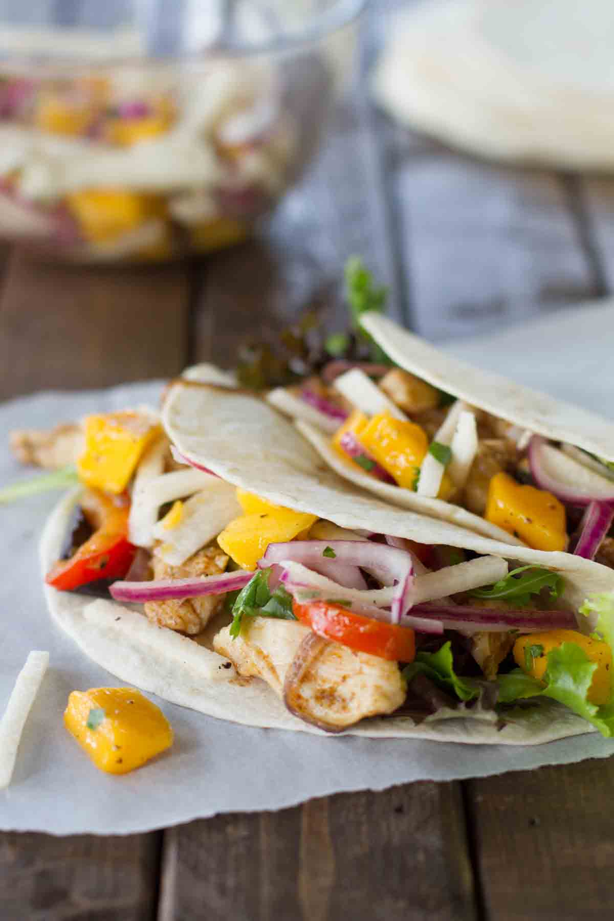 No more boring tacos! These Easy Chicken Tacos with Mango and Jicama are easy, fast, and full of flavor. There are so many flavors and textures, you won’t believe that this is an easy weeknight dinner! Two Easy Chicken Tacos with Mango and Jicama