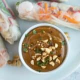 Peanut sauce topped with chopped peanuts and cilantro