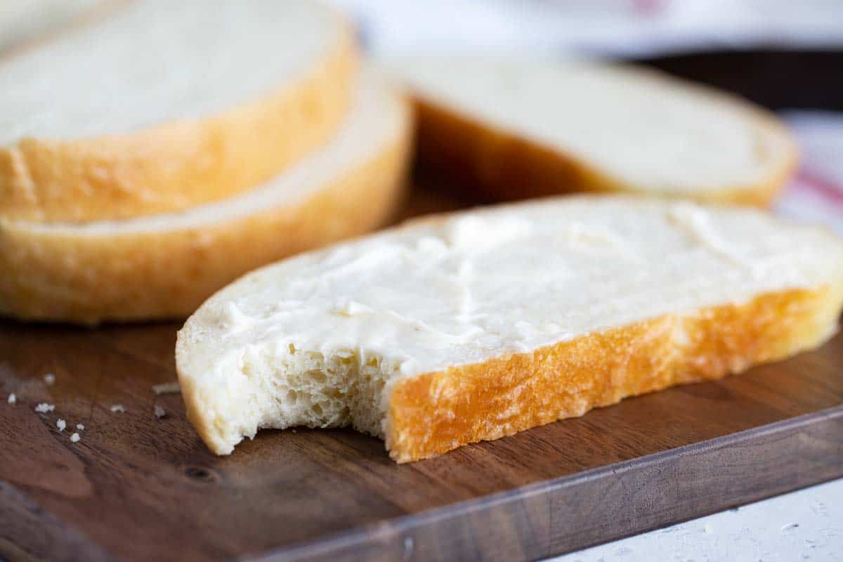 slice of peasant bread with a bite taken from it