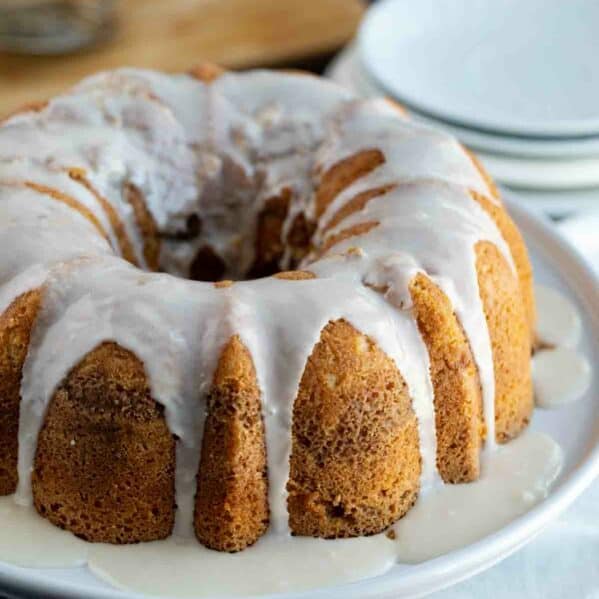 Coffee cake bundt cake on a platter with maple glaze