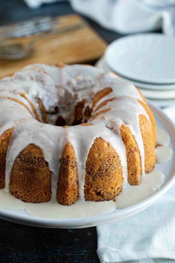 Coffee cake bundt cake on a platter with maple glaze