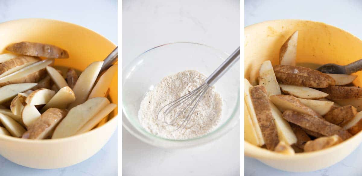 Bowl with potato wedges and flour and spice mixture being mixed in.