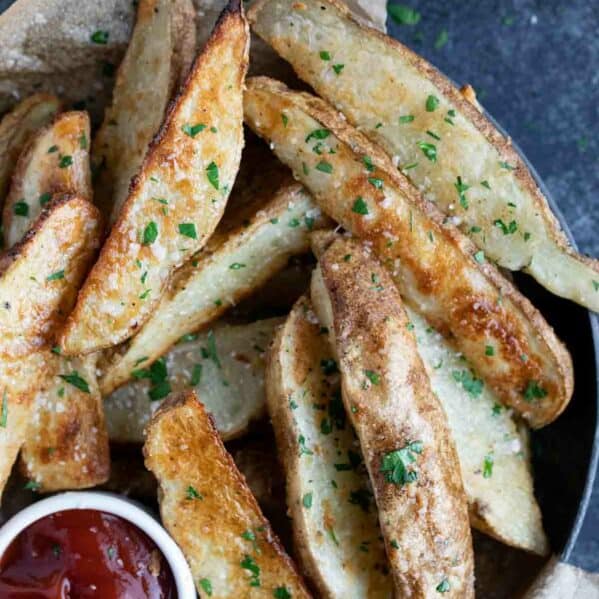 baked potato wedges sprinkled with salt and parsley.