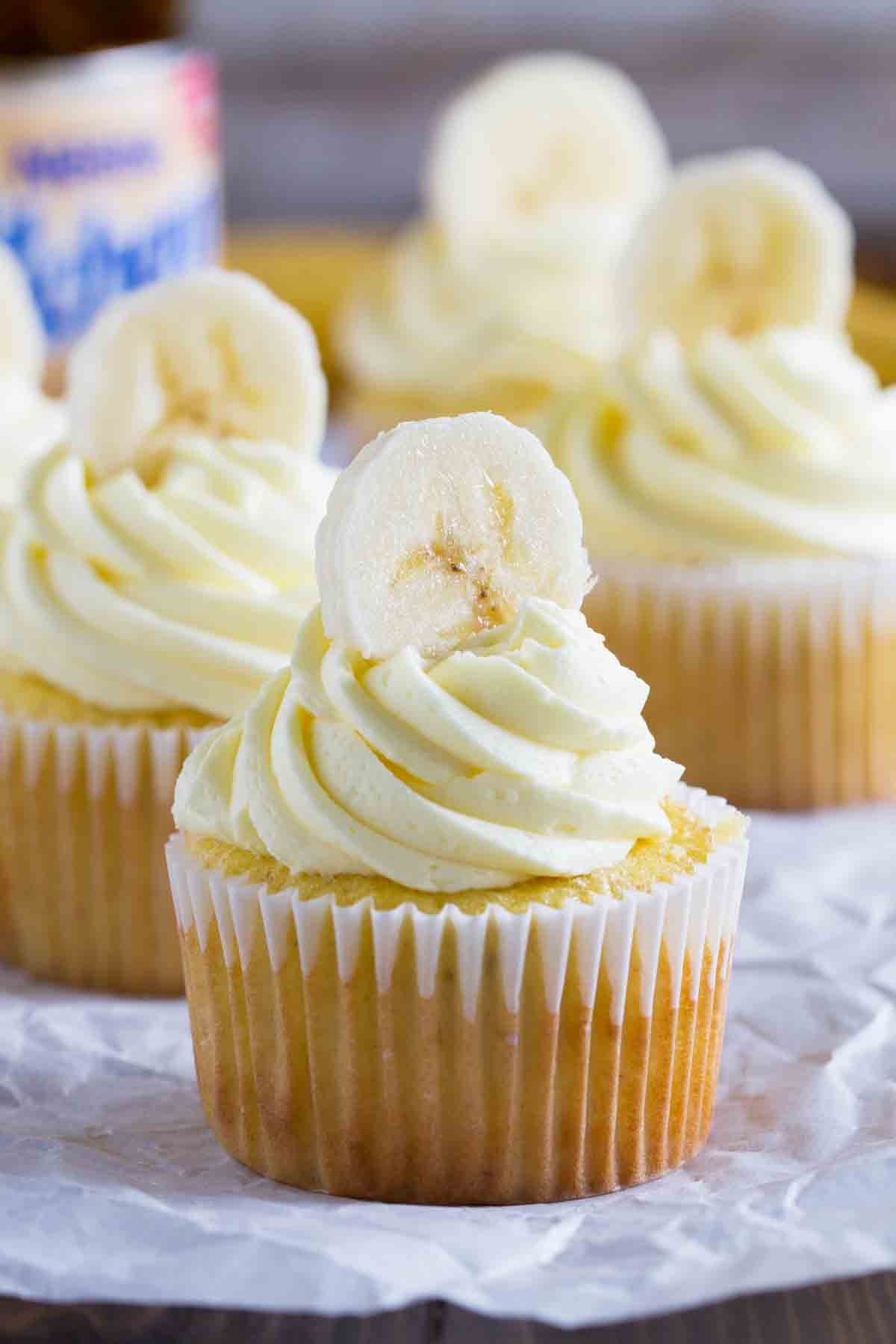 Bananas Foster Cupcakes topped with fresh bananas.