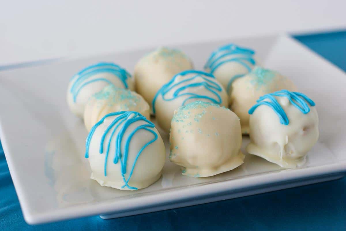 9 Coconut Cake Truffles on a square plate.