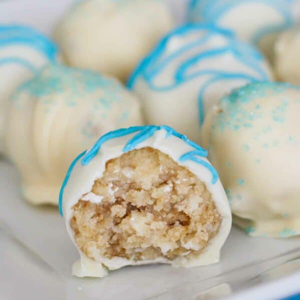 Coconut Cake Truffle with a bite taken from it.