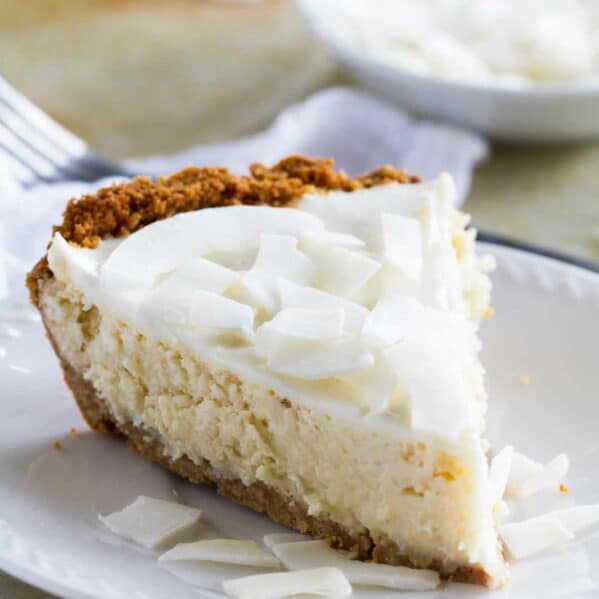 Slice of Coconut Cheesecake Pie on a plate.