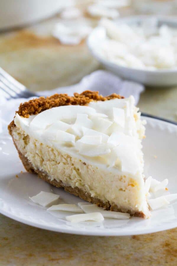 Slice of Coconut Cheesecake Pie on a plate.