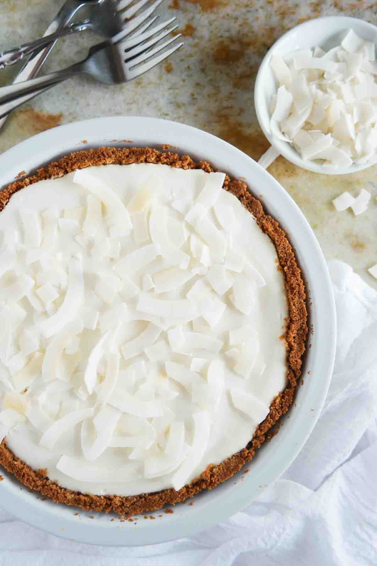 Full Coconut Cheesecake Pie with a graham cracker crust.
