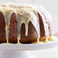 Coconut Orange Pound Cake with icing on a cake plate.