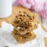 Coconut Pecan Bars stacked on top of each other.