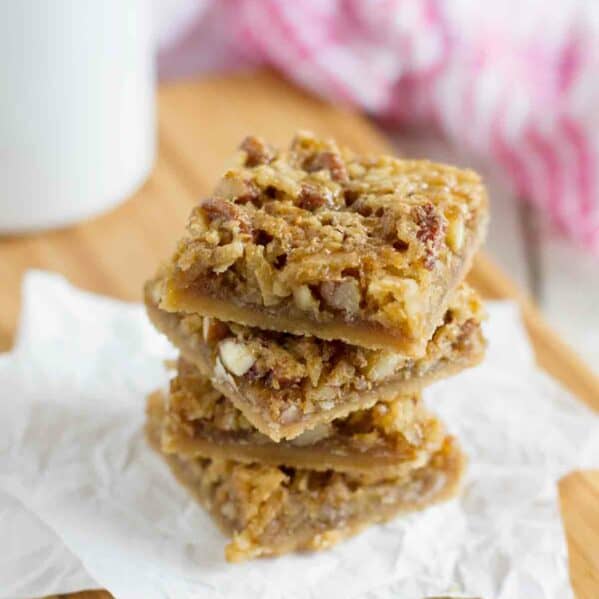 Coconut Pecan Bars stacked on top of each other.