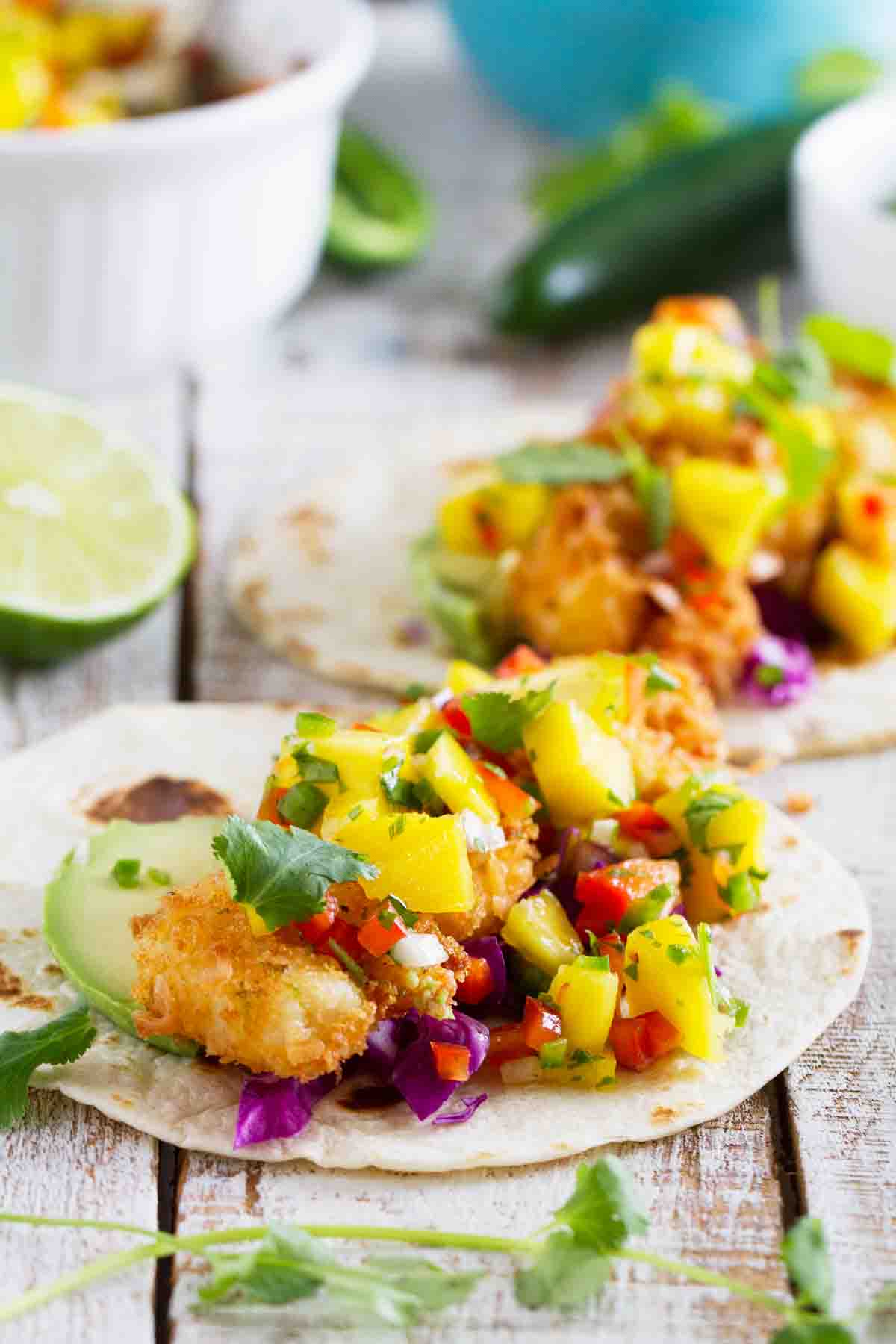 Tacos with coconut shrimp on flour tortillas