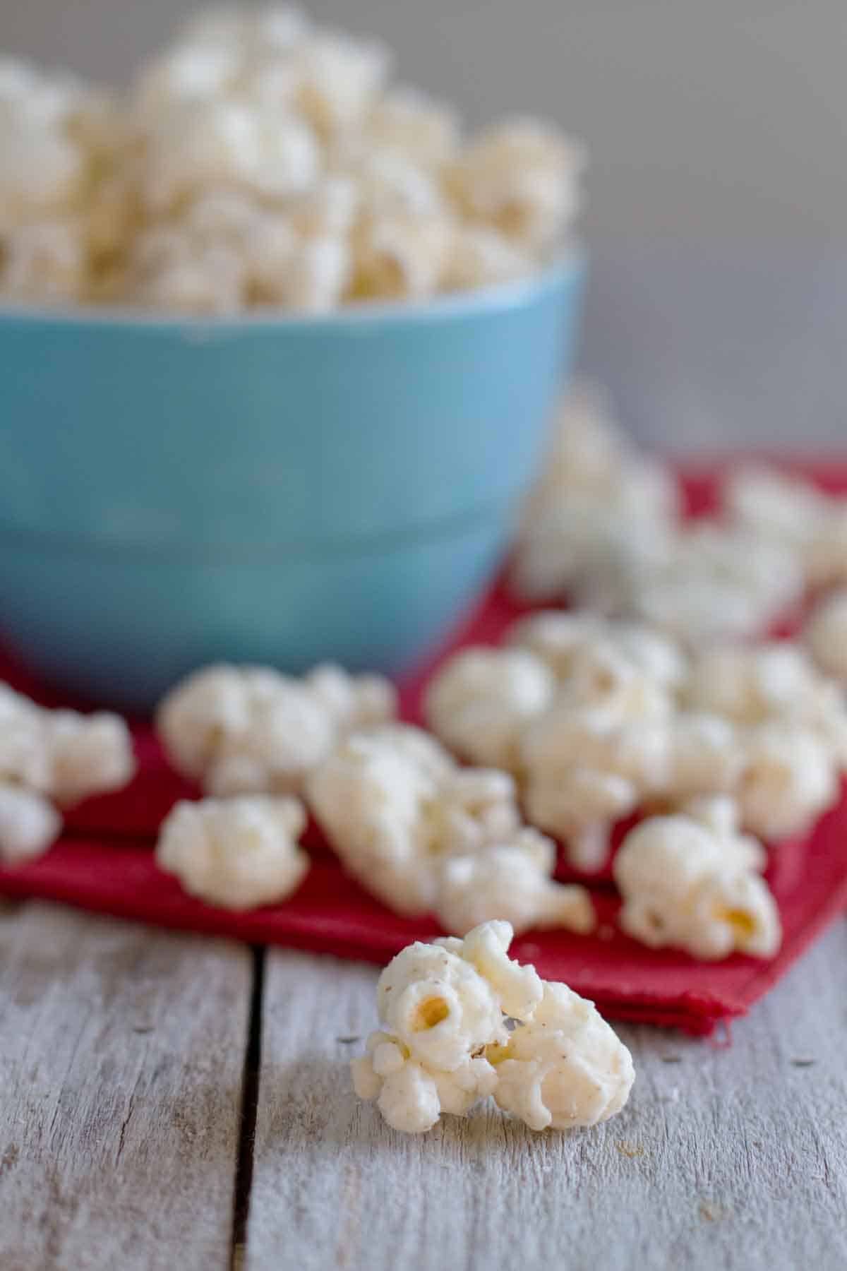 pieces of Eggnog Popcorn beside a bowl