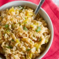 Enchilada Rice in a bowl topped with cilantro