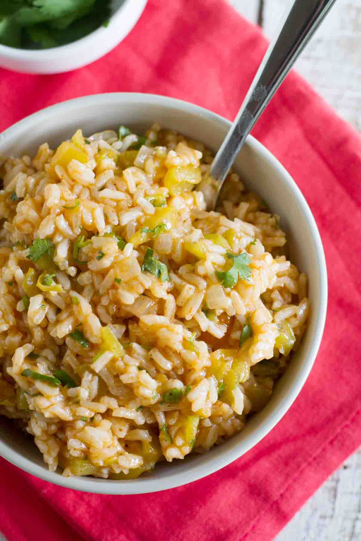 Enchilada Rice in a bowl topped with cilantro