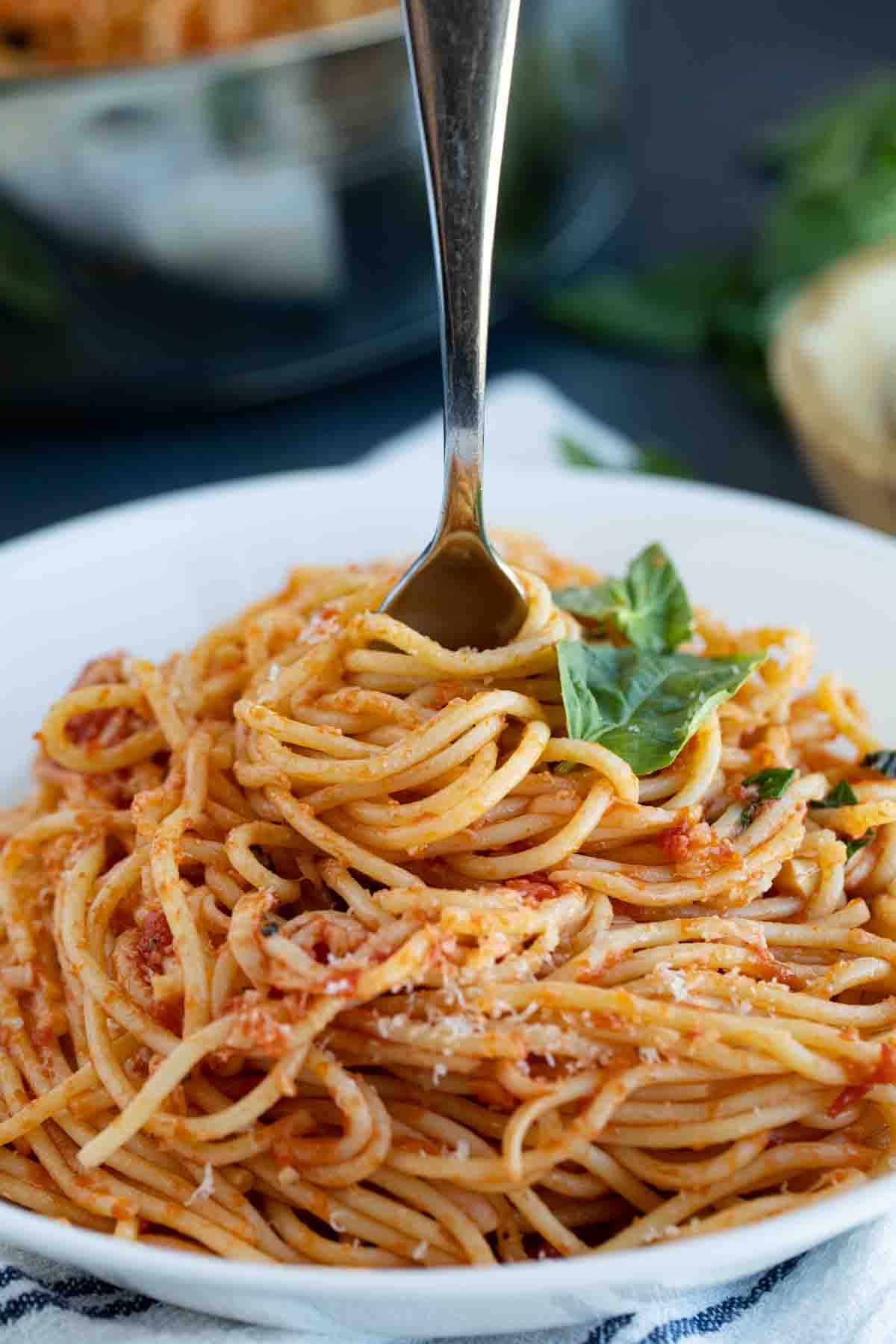 Garlic Spaghetti in a bowl with a fork in the middle