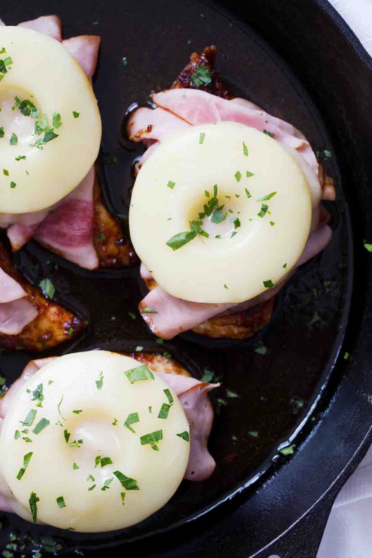 Hawaiian Chicken with Ham and Pineapple in a cast iron pan.