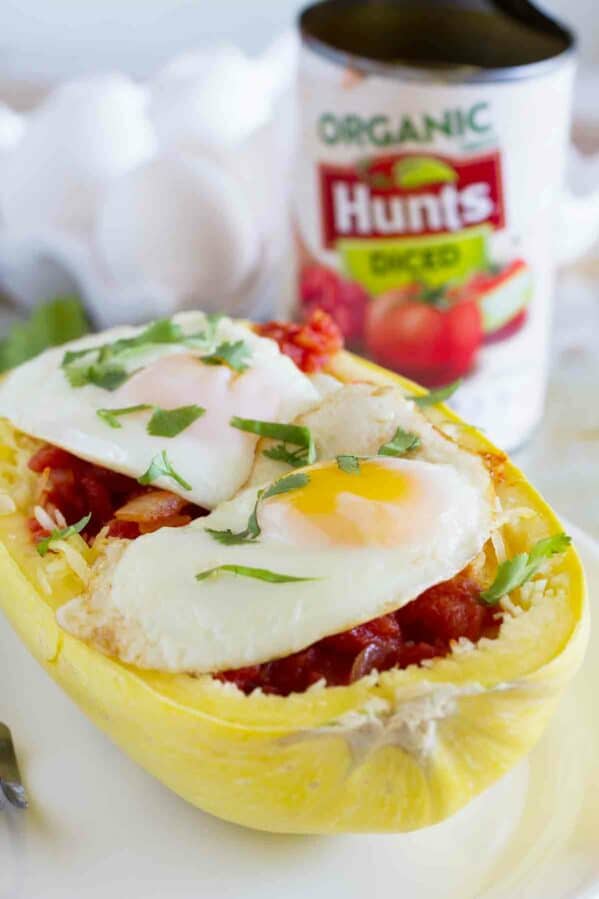 Huevos Rancheros Inspired Spaghetti Squash - squash topped with tomato sauce and fried eggs.