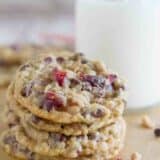 Four Oatmeal Cranberry Cookies stacked on top of each other.