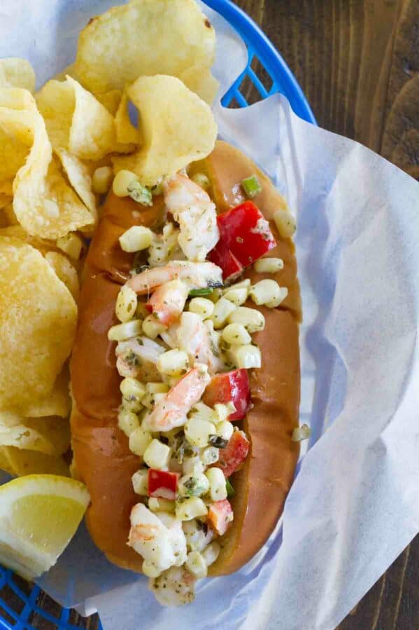 Shrimp rolls made with corn and peppers served with potato chips.