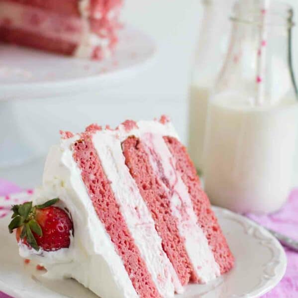 Slice of Strawberry Milkshake Ice Cream Cake on a plate.